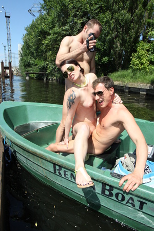Slut with dark hair and nice boobs gets fucked by two men in a boat - XXXonXXX - Pic 7