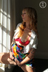 Smoking hot blonde reveals her indulging tits and steaming hot body in