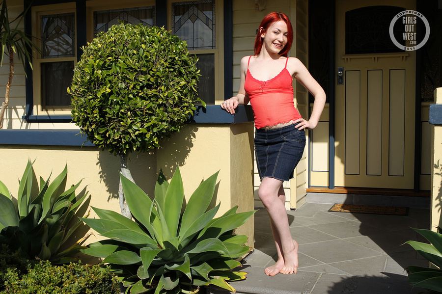 Steaming hot redhead displays her foxy body in red lingerie and jeans skirt before she peels off her nighty and bares her petite boobs then strips down her panty and expose her lusty ass in different poses outside her ass. - XXXonXXX - Pic 1