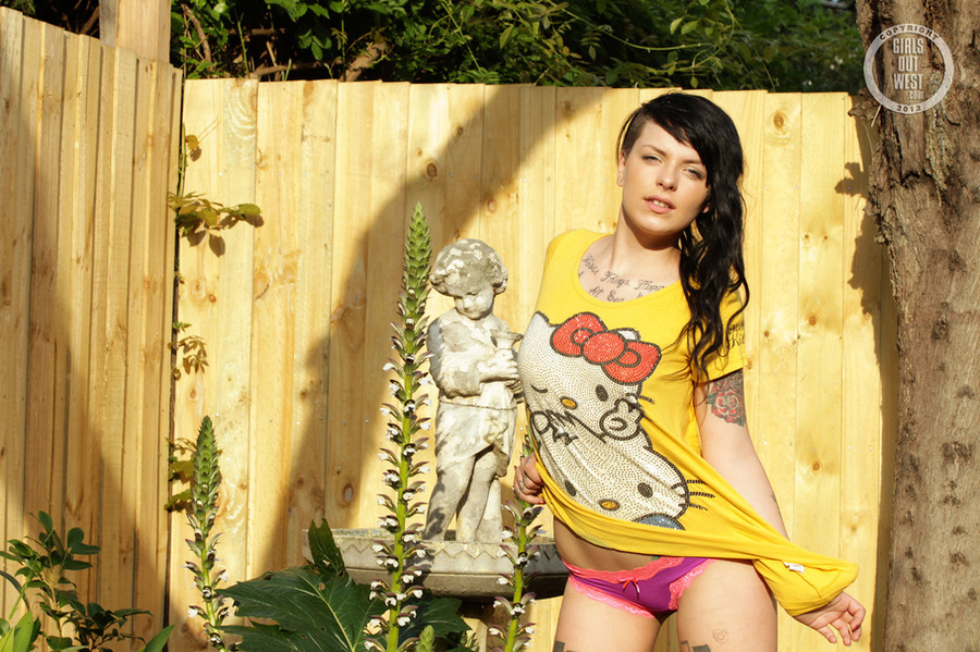 Steaming hot chick peels off her yellow Hello Kitty dress and shows her juicy boobs before she nails down her juicy crack with a red dildo in different positions in her backyard. - XXXonXXX - Pic 1