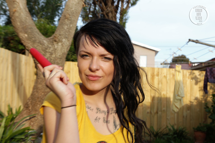 Steaming hot chick peels off her yellow Hello Kitty dress and shows her juicy boobs before she nails down her juicy crack with a red dildo in different positions in her backyard. - XXXonXXX - Pic 15