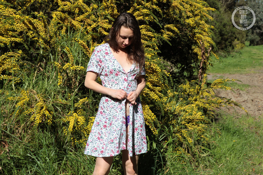 Steaming hot chick strips off her multi colored floral dress and expose her sweet boobs and foxy body then pulls down her purple panty and reveals her luscious pussy by a wattle tree. - XXXonXXX - Pic 7