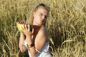Blonde babe with glasses teases with her foxy body while she eats her watermelon in a crop field before she stips off her white dress and shows her lusty pussy and sweet crack in different poses in a crop field. - XXXonXXX - Pic 3