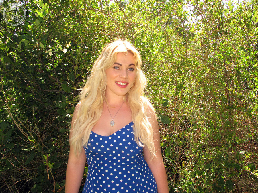 Blonde bombshell teases with her indulging body in blue and white polka dotted dress, pink and white panty and black boots before she gets naked and bares her hot boobs and luscious pussy in a forest. - XXXonXXX - Pic 3