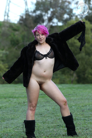 Pink haired chick display her foxy body outdoor wearing her black lingerie, coat and boots then shows her juicy boobs before she pulls down her black panty and reveals her indulging pussy. - Picture 9