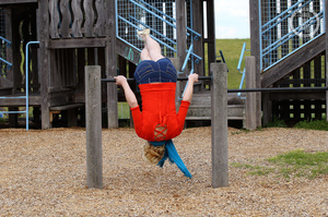 Steaming hot blonde pose her banging body before she strips off her red blouse and multi colored polka dotted bra and expose her small boobs before she pulls down her jeans shorts and pink panty and nails her crack with a purple dildo in different poses in a playground. - Picture 3