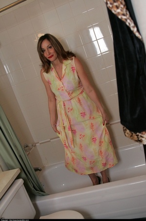 Floral dress brunette posing naked in a full bath tub - XXXonXXX - Pic 2