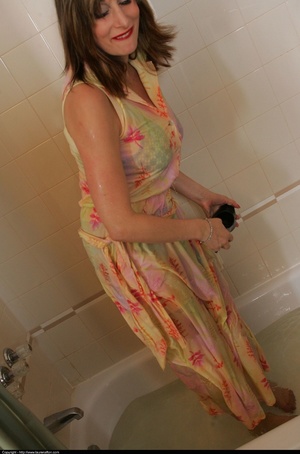 Floral dress brunette posing naked in a full bath tub - XXXonXXX - Pic 8