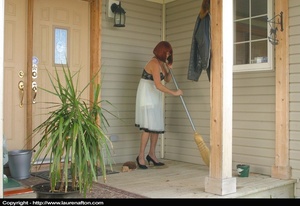 Redhead MILF cleaning her porch, stripping and peeing - Picture 1