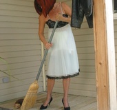 Redhead MILF cleaning her porch, stripping and peeing