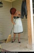 Redhead MILF cleaning her porch, stripping and peeing
