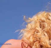 Blue bikini blonde MILF masturbating and sunbathing