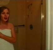 Brunette with tiny tits gets on all fours on a bed