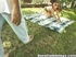 Shades-wearing redhead gives him a footjob on a picnic