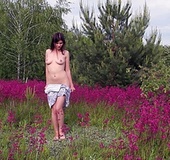 Busty brunette taking off grey dress outdoors sheds tight dress before