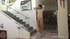 Sheer white top brunette fucks a glass dildo on the stairs