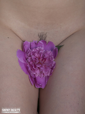 Gorgeous chick displays her skinny body in purple underwear before she peels off her bra and shows her small tits then pulls down her panty and reveals her juicy pussy in different poses in a garden of tulip. - XXXonXXX - Pic 11