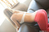 Yoga pants blonde with white bra gets naked on a leather couch