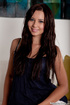 Blue top wavy-haired blue-eyed babe shows her pussy