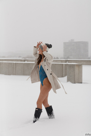 Prancing in the snow, this slim, nubile, - Picture 2