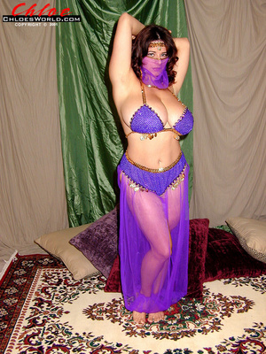 Busty brunette belly dance slowly taking - Picture 1