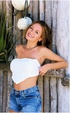 White bra sensual brunette posing topless outdoors