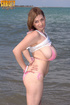 Tight blue shorts brunette fucks a red dildo seaside