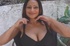 Brunette with red streaks sucking on a massive dong
