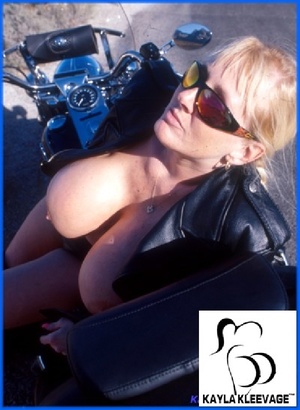Biker chick in leather shows off her giant tits outdoor. - XXXonXXX - Pic 4