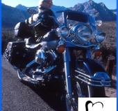 Biker chick in leather shows off her giant tits outdoor.