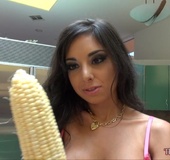 Brunette fucks her pussy with corn, cucumbers and carrots