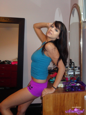 Pink panties and blue tank-top brunette shows her holes - Picture 1