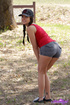 Tight shorts and baseball cap brunette stripping outdoors