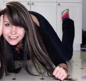 Kinky brunette lifts her tight black long sleeves and pulls down her denim