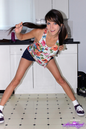 Playful brunette with pigtails wearing t - Picture 1