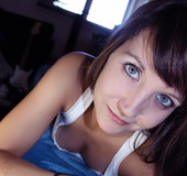 Gray eyed beauty wearing white top on her perfect tits and blue shorts