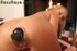 Sexy blonde wearing furry red vest and black outfit gets nude by the warm