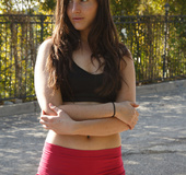 Fit brunette in red shorts gets nude outdoors