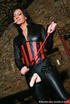 Smoking lass in leather bodysuit and red boots asked masked guy to suck