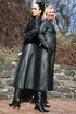 Two sexy cunts in leather coats and boots undressing outdoors and enjoying