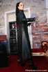 Red lipped stunner in leather outfit and high boots teasing her shaved