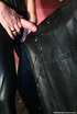 Black haired lass in leather coat and corset gets cum covered after sucking