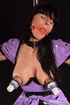 Latex-y schoolgirl-y outfit brunette gets ballgagged and nipple-pumped