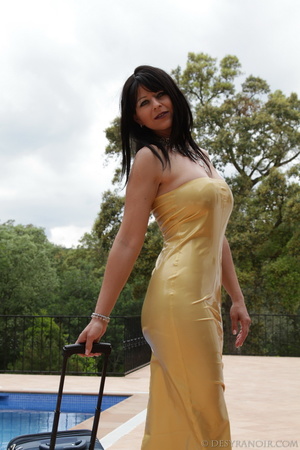 Yellow latex dress brunette posing next to a swimming pool with suitcase - Picture 9