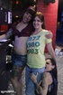 Sexy babes tease their tits and pussies at the bar.