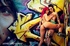 Two hot girls get naked and suck dick in front of graffiti.
