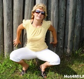 Shades-wearing blonde MILF with pink bra gets fucked outdoors