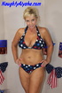 Patriotic blonde whore wearing red, white, and blue star bikini sits on
