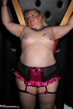 Blonde bbw with pierced nipples posing in fishnet hose and showing her pink snatch in the bdsm dungeon - XXXonXXX - Pic 3