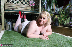 Pierced pussy bbw in red heels and white stockings riding huge dildo on the bench outdoors - Picture 15